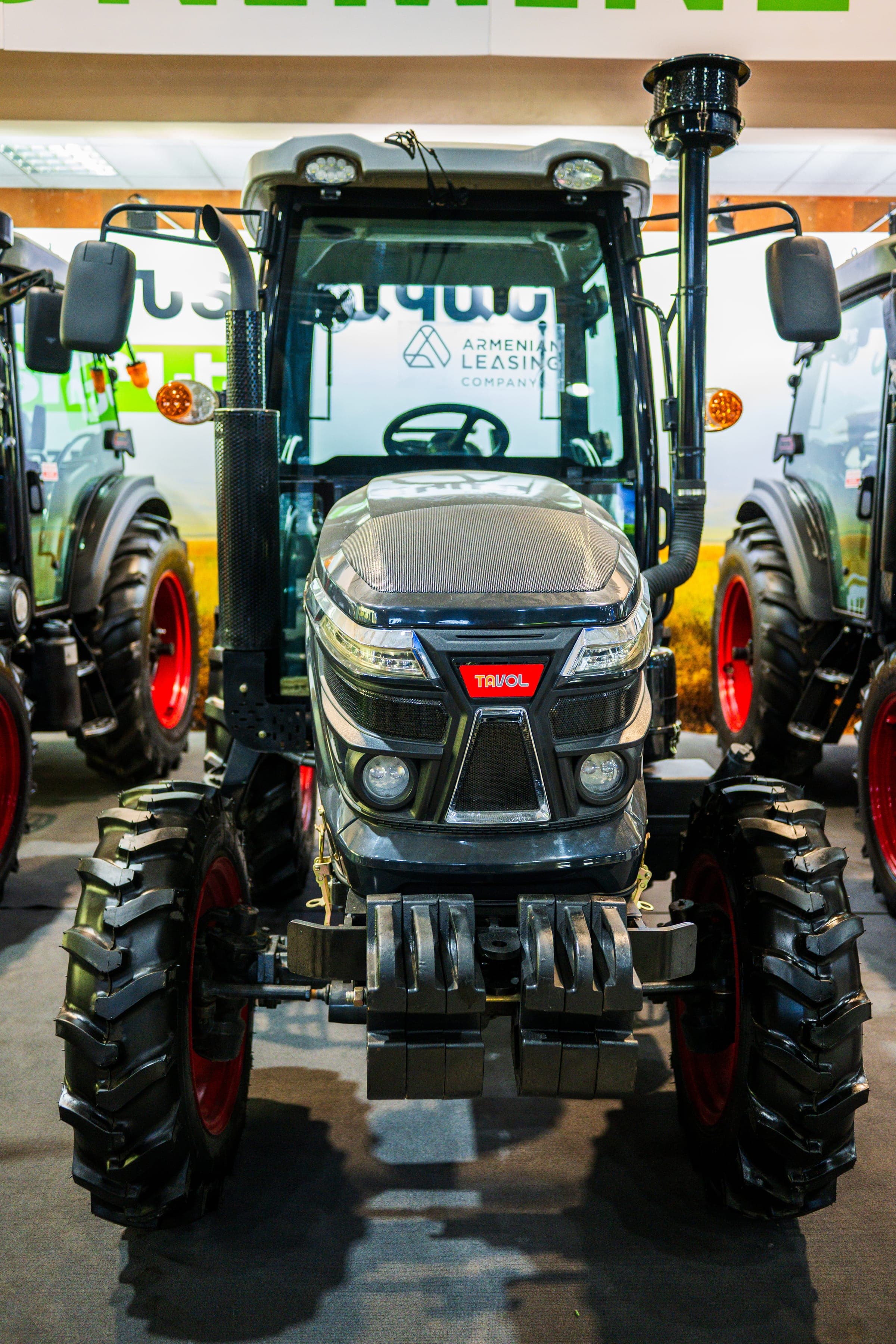 Front of a black tractor with an enclosed cab