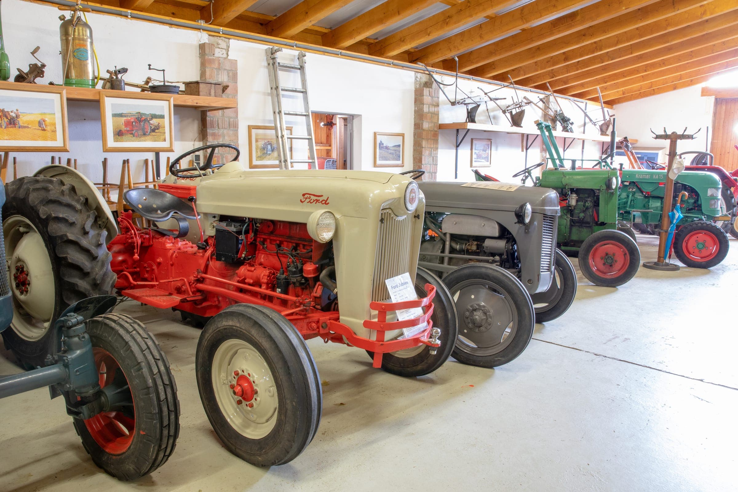 Classic tractors in a machinery museum hall